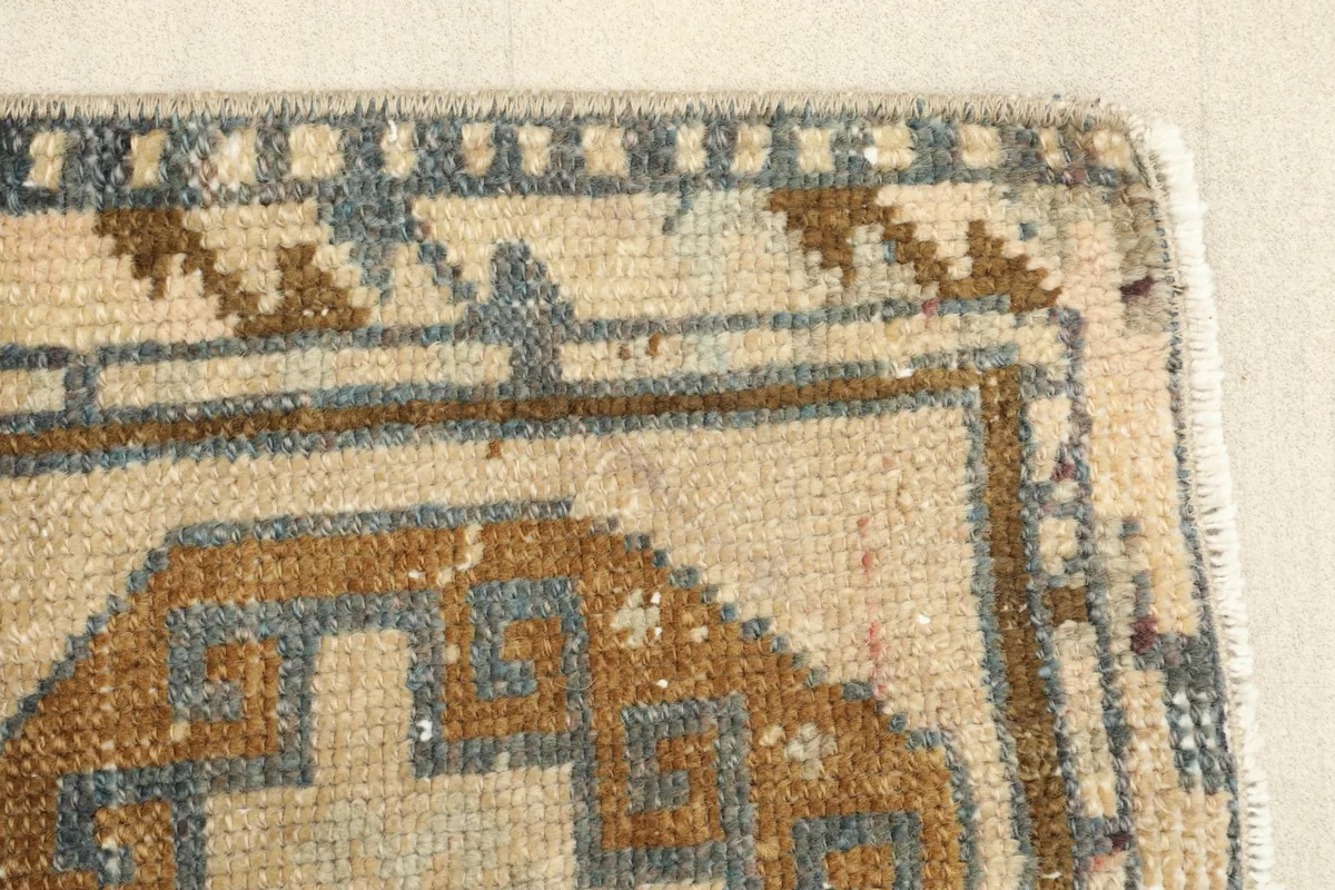 Close-up of the bottom right corner and border, showing subtle wear and color variations.