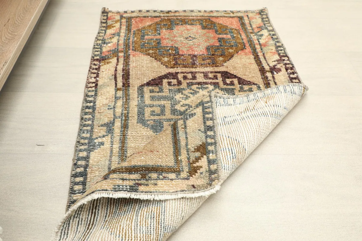 The rug folded to show its flexibility and the texture of the back and front.