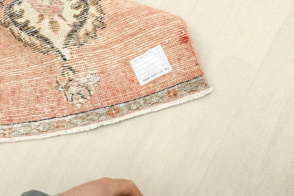 Close-up of the back of the rug, illustrating the hand-knotted construction