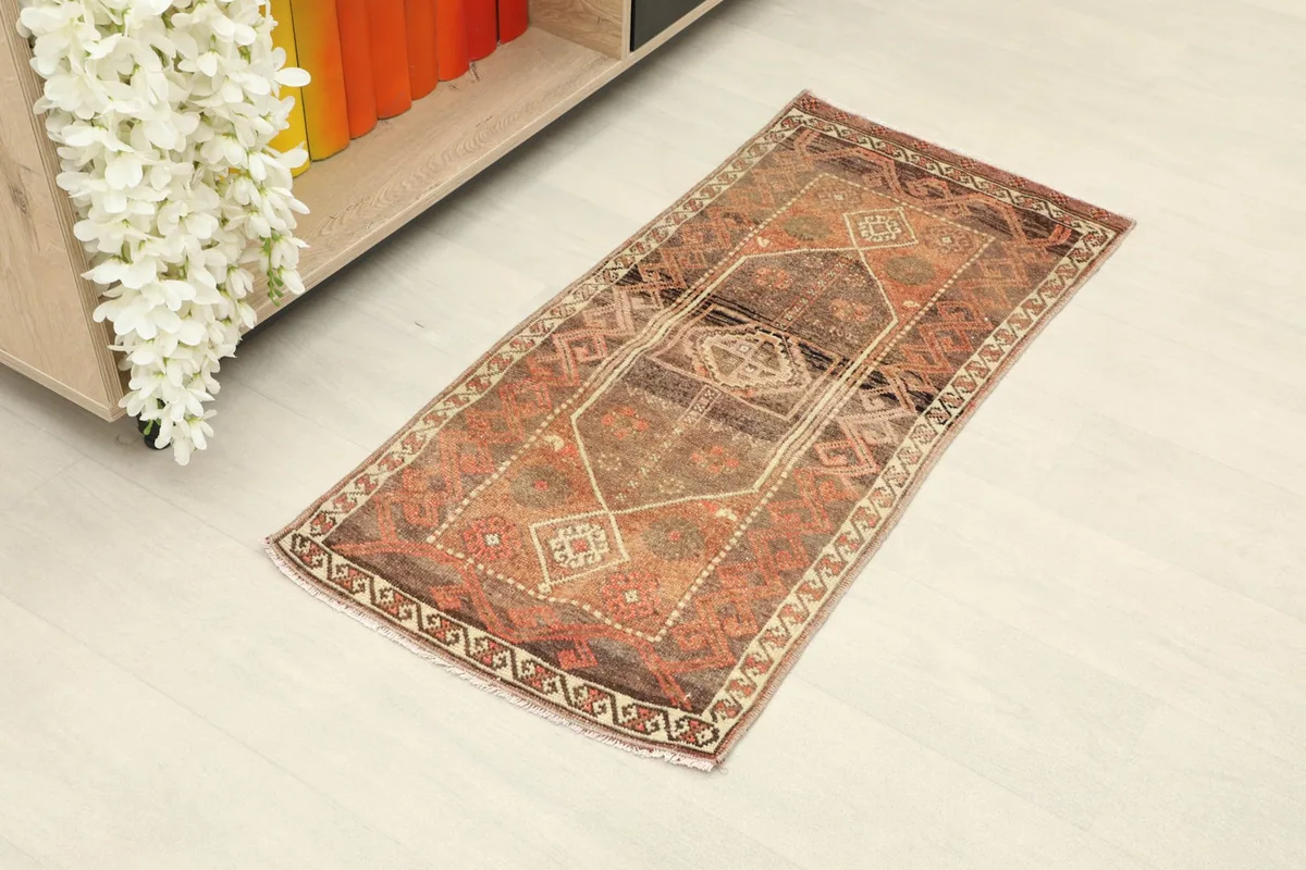 Angled view of the doormat in a room, showcasing its rectangular shape and colors against the floor