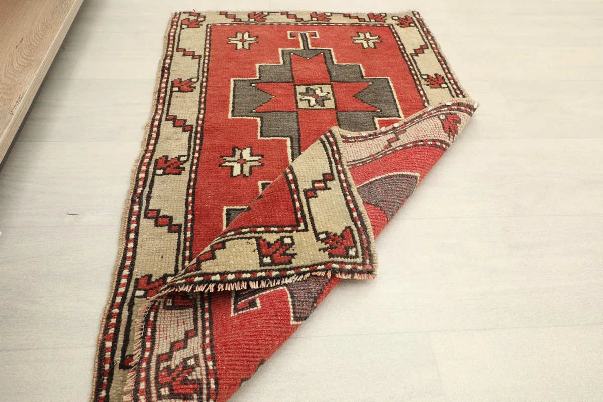 Another view of the rug folded, showing its flexibility and construction.