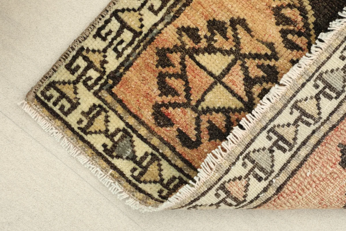 View of the rug folded at a corner, showcasing the pile height and construction.