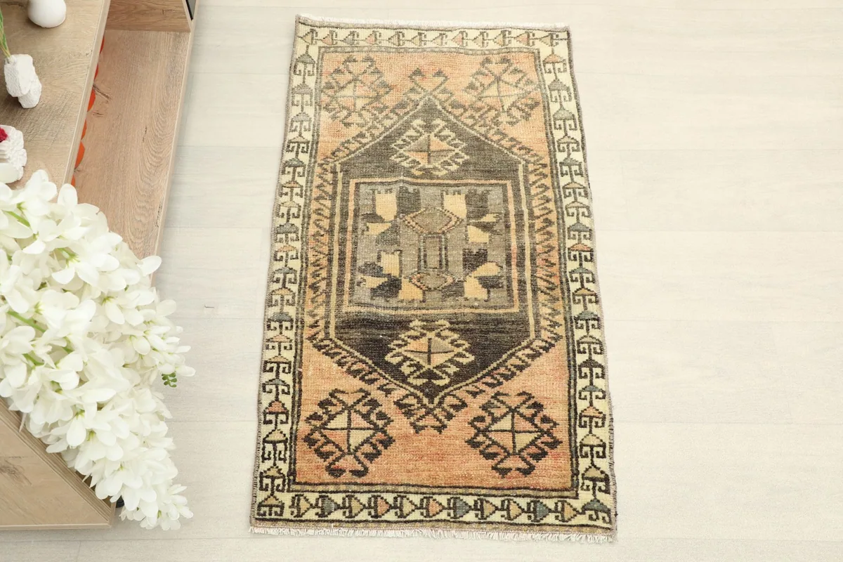 Overhead view of the hand-knotted wool rug, showing its full design and colors.