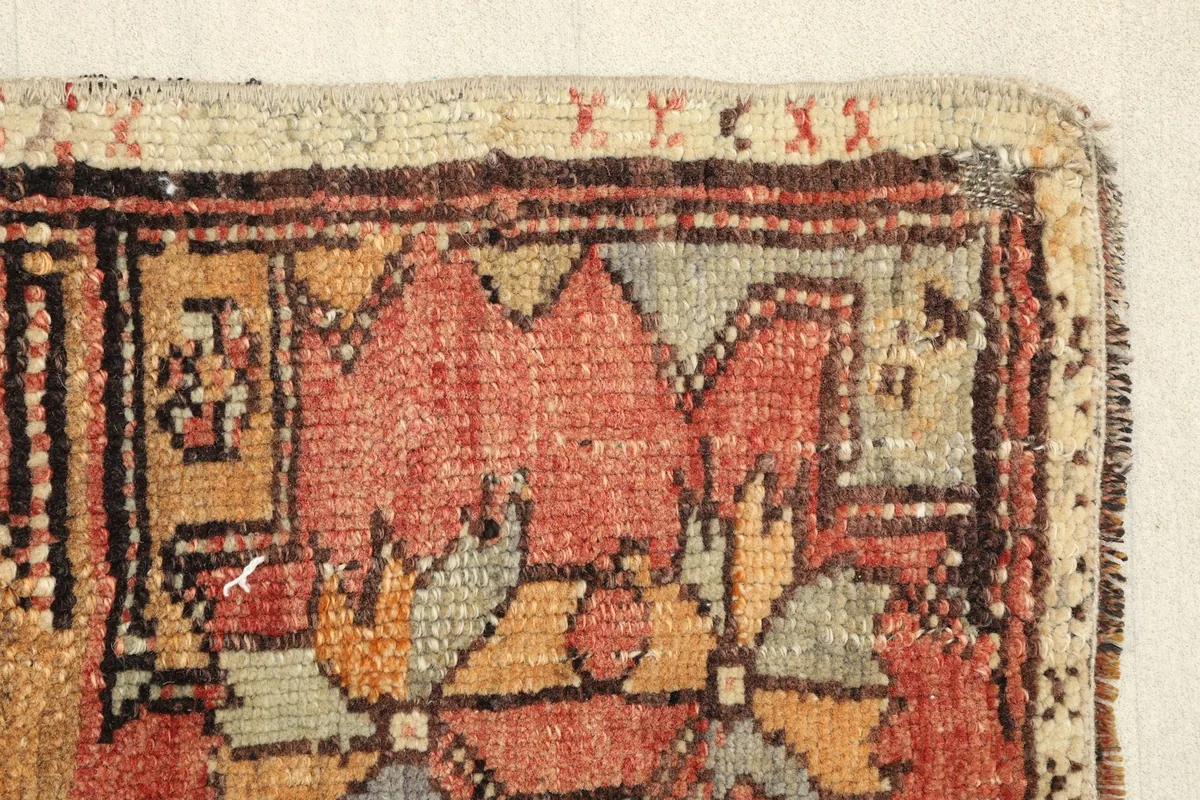 Close-up of a section of the rug, revealing the low pile and individual knots