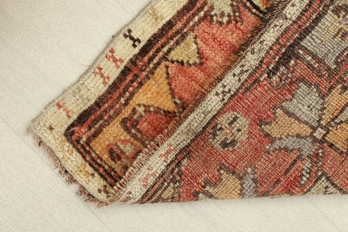 View of the rug folded, demonstrating its flexibility and thickness