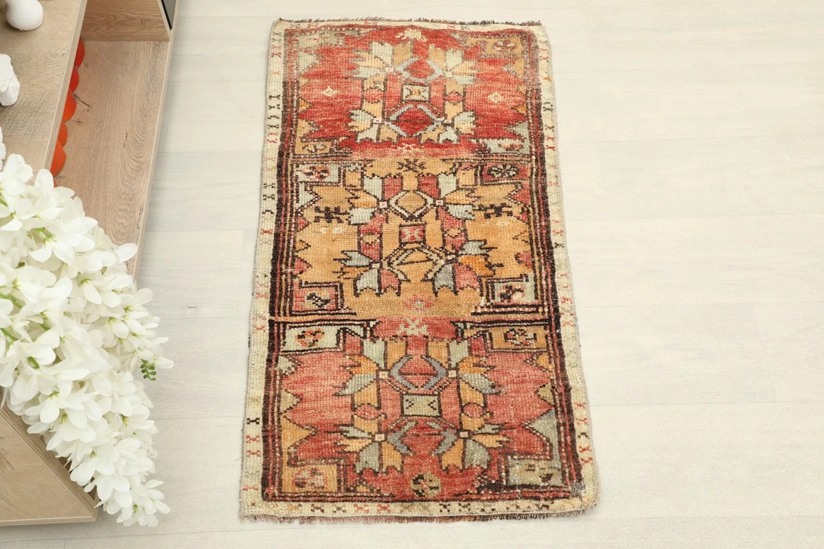 Overhead view showing the full pattern and colors of the hand-knotted vintage rug