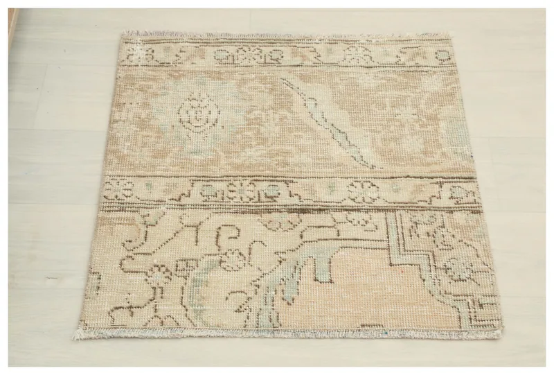 Full top view of the 2'0" x 2'2" vintage Anatolian doormat on a white background