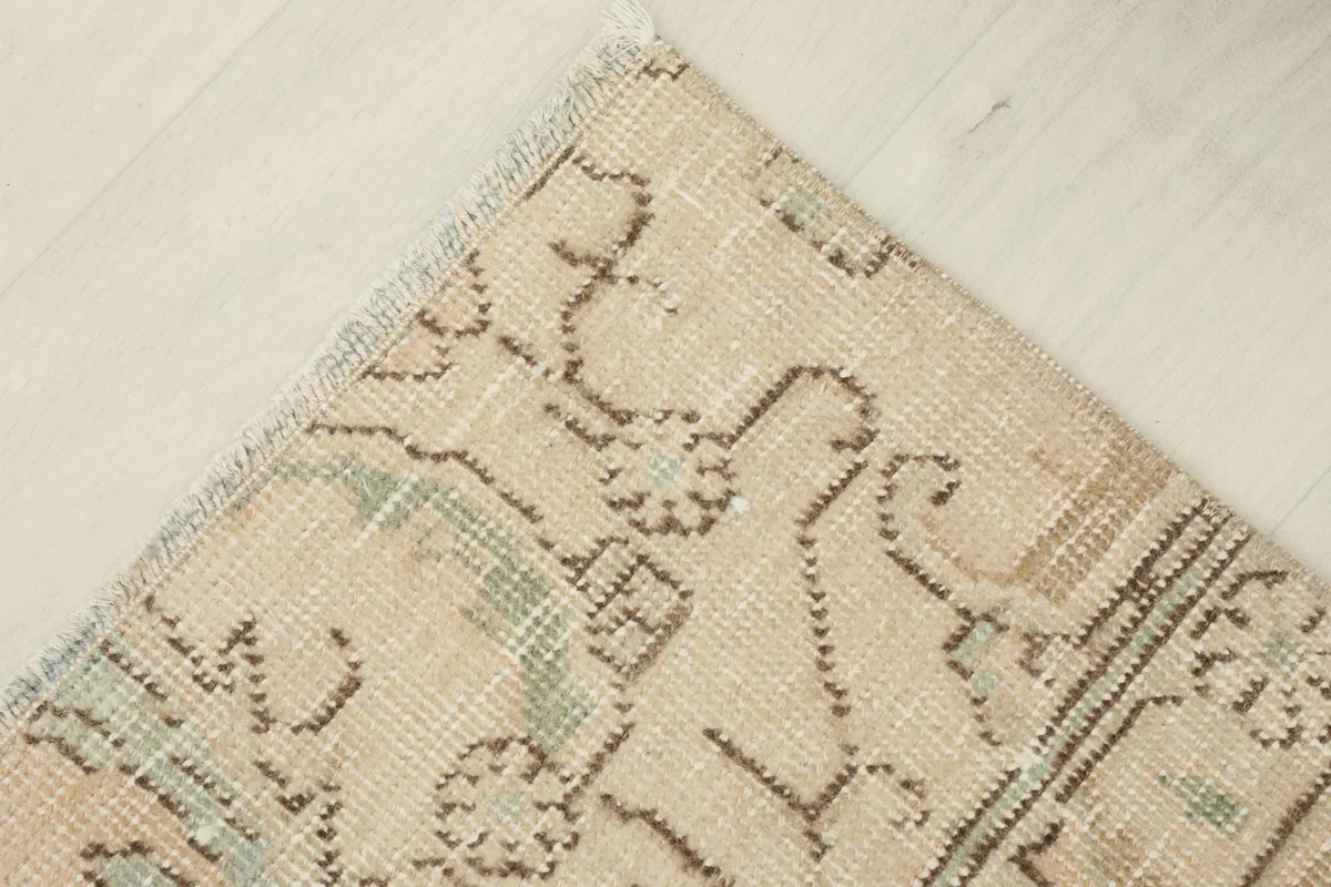 Corner view of the doormat, emphasizing the natural wear and unique character