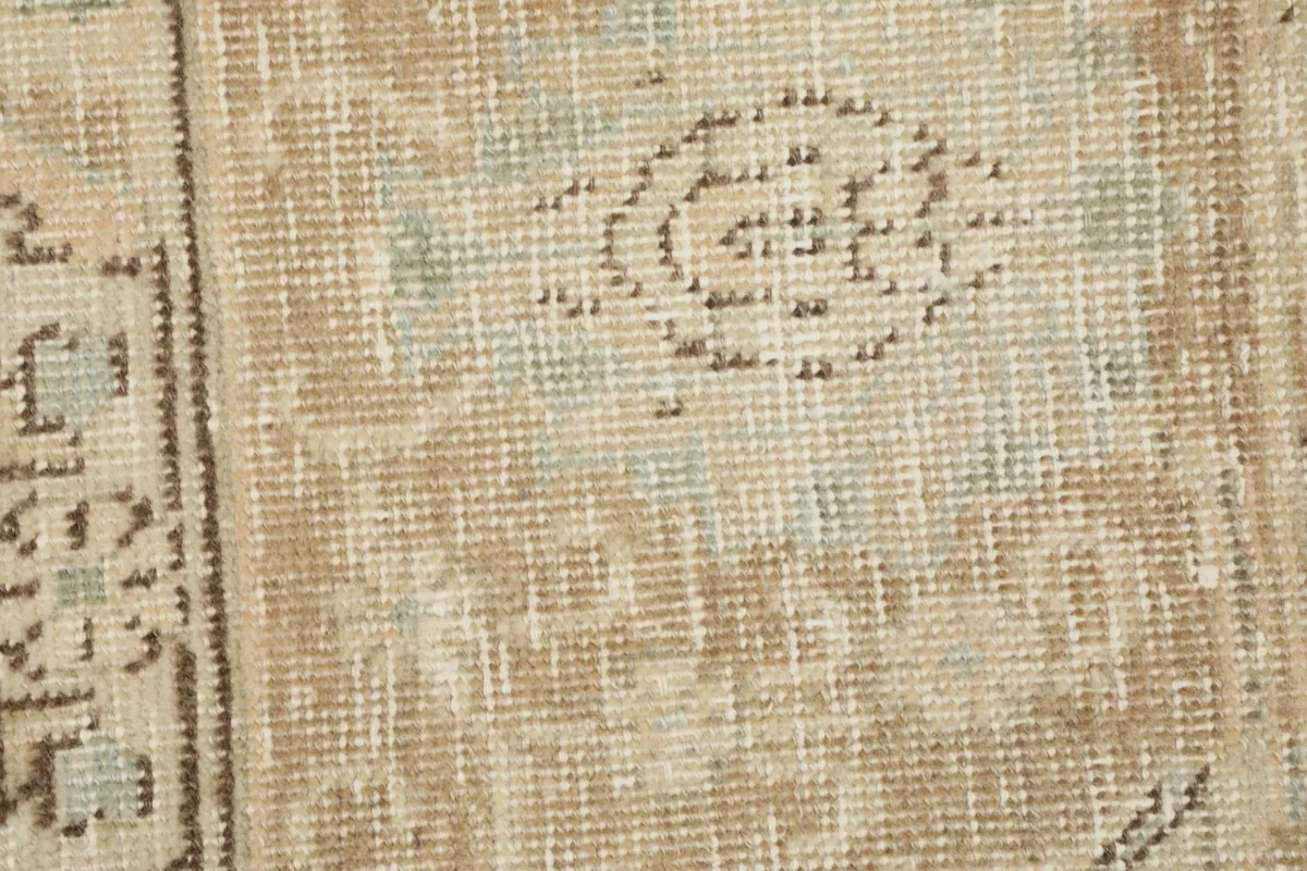 Detailed view of the low wool pile and the intricate hand-knotted weaving
