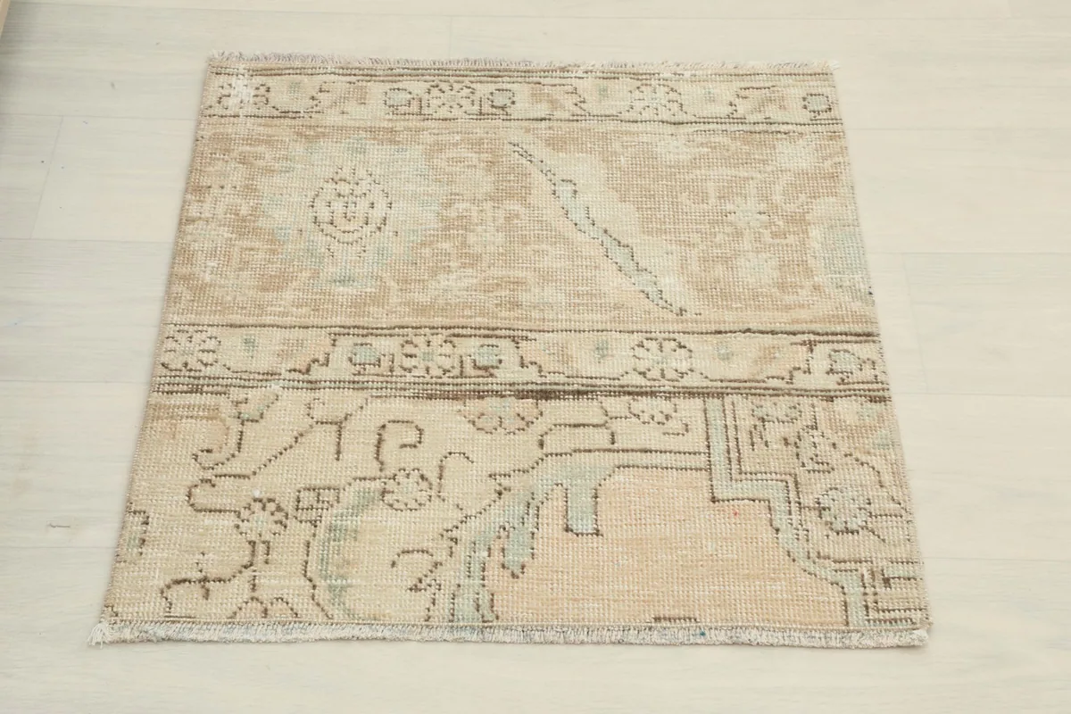 Direct overhead view of the vintage doormat, showing its overall shape and design