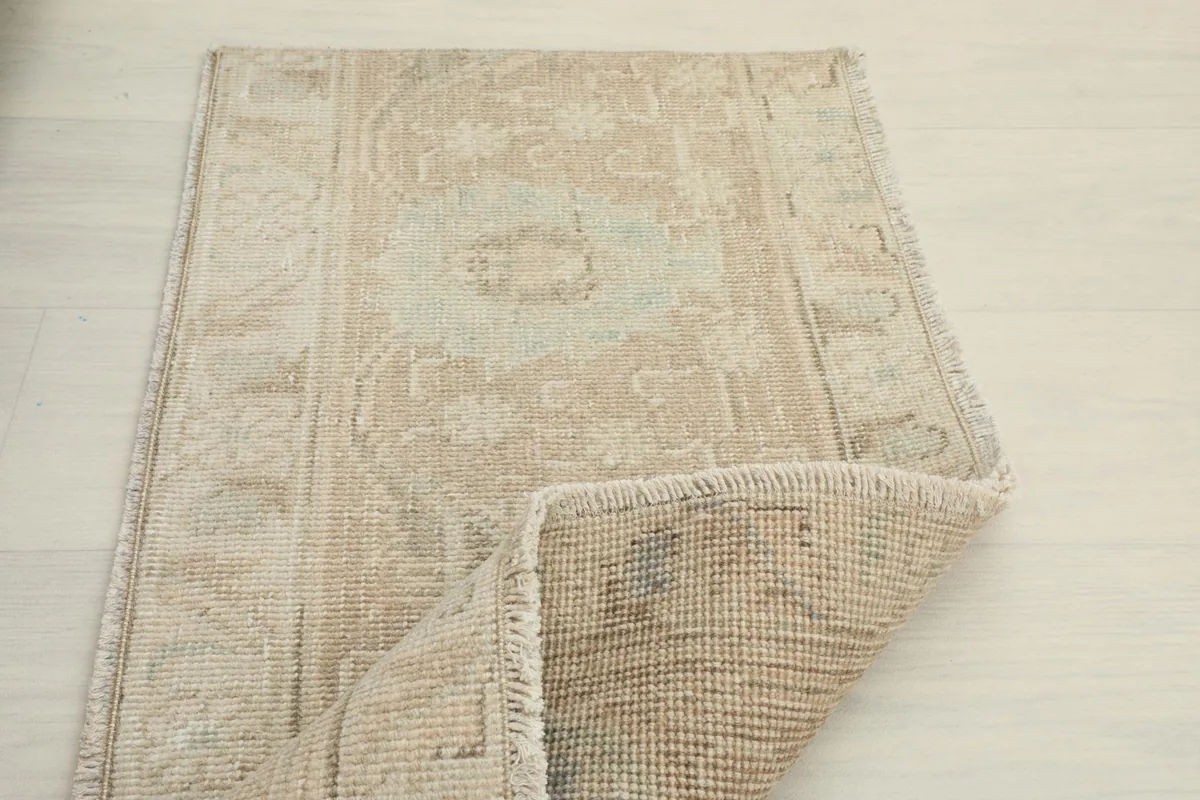 Partial fold of the rug demonstrating its flexibility and construction