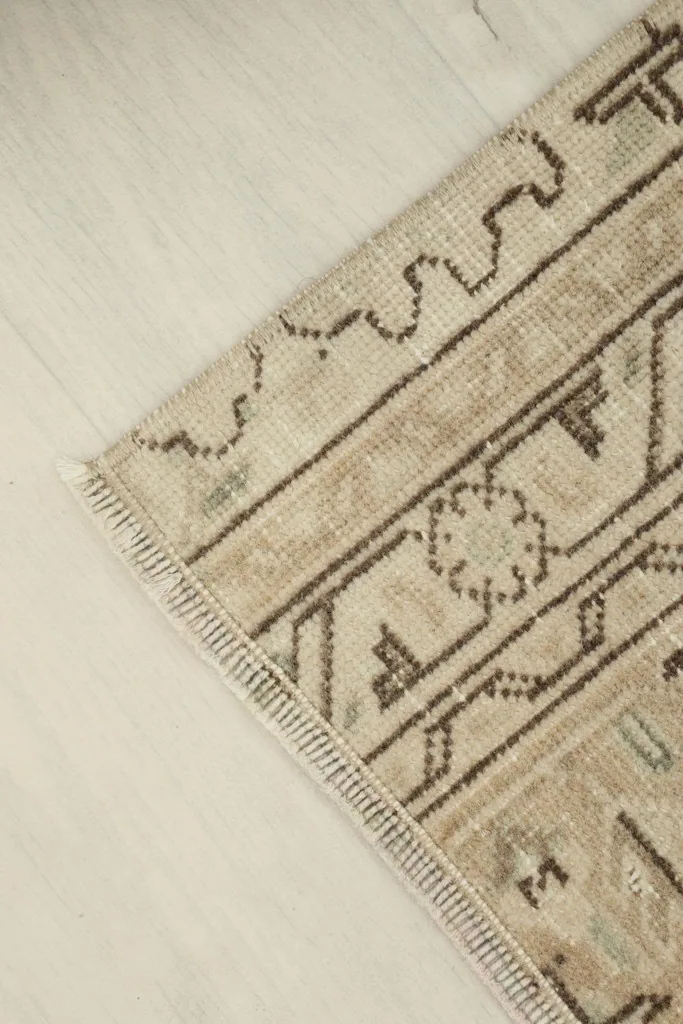 Overhead angled view of the doormat, emphasizing its compact size and overall pattern.