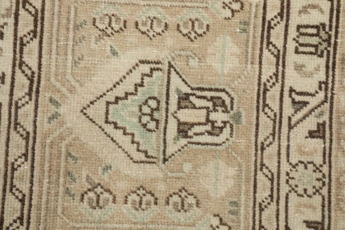 Zoomed-in section highlighting the intricate hand-knotted details and subtle color variations.