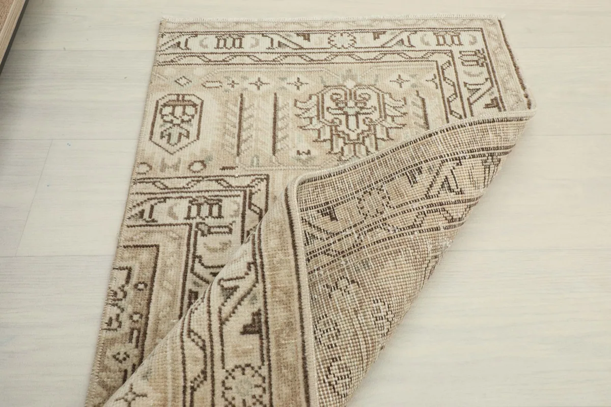 Another folded view demonstrating the rug's flexibility and the detailed patterns on the front.