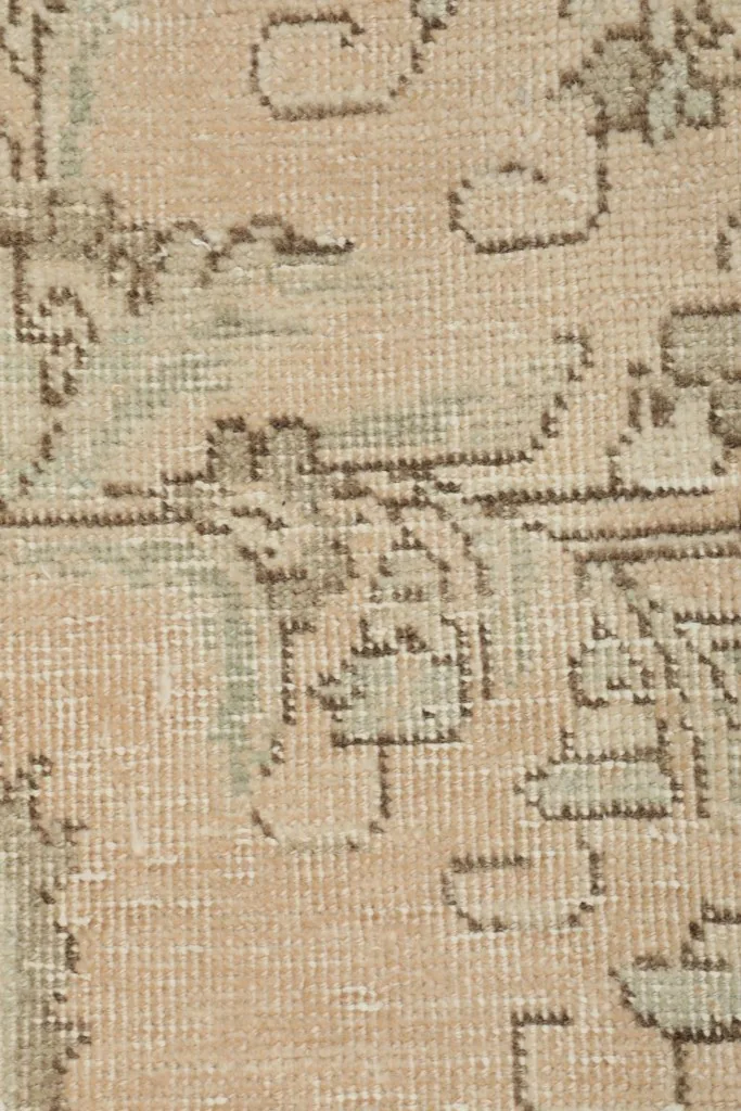 Close-up of the rug's surface, highlighting the texture and subtle color variations.