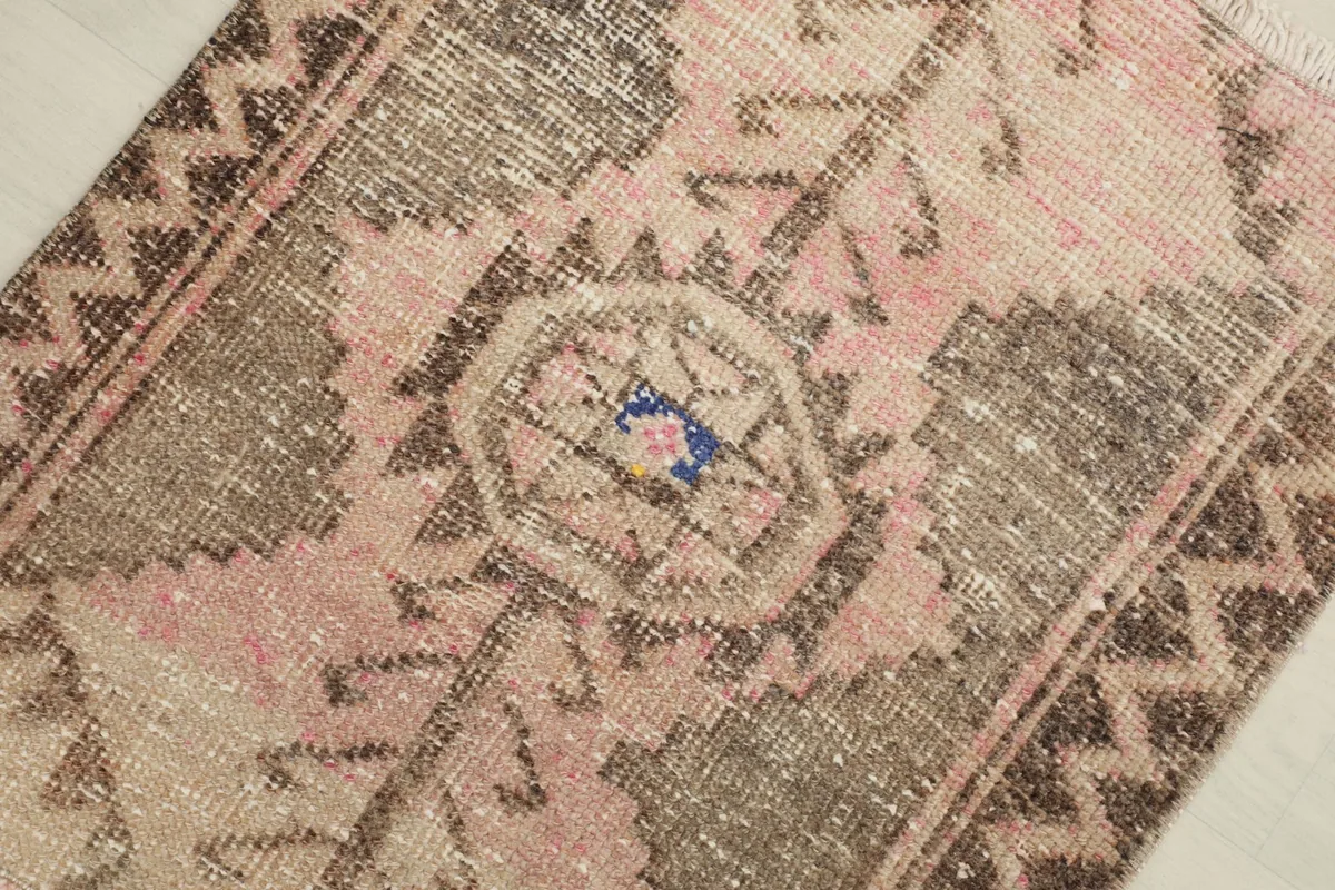 Overhead angled shot highlighting the central geometric medallion and surrounding tribal patterns