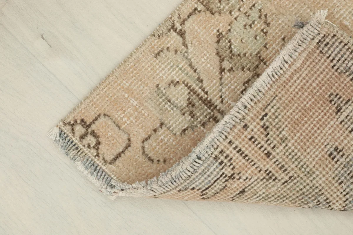 The rug folded to show the flexibility of the wool pile and cotton foundation.