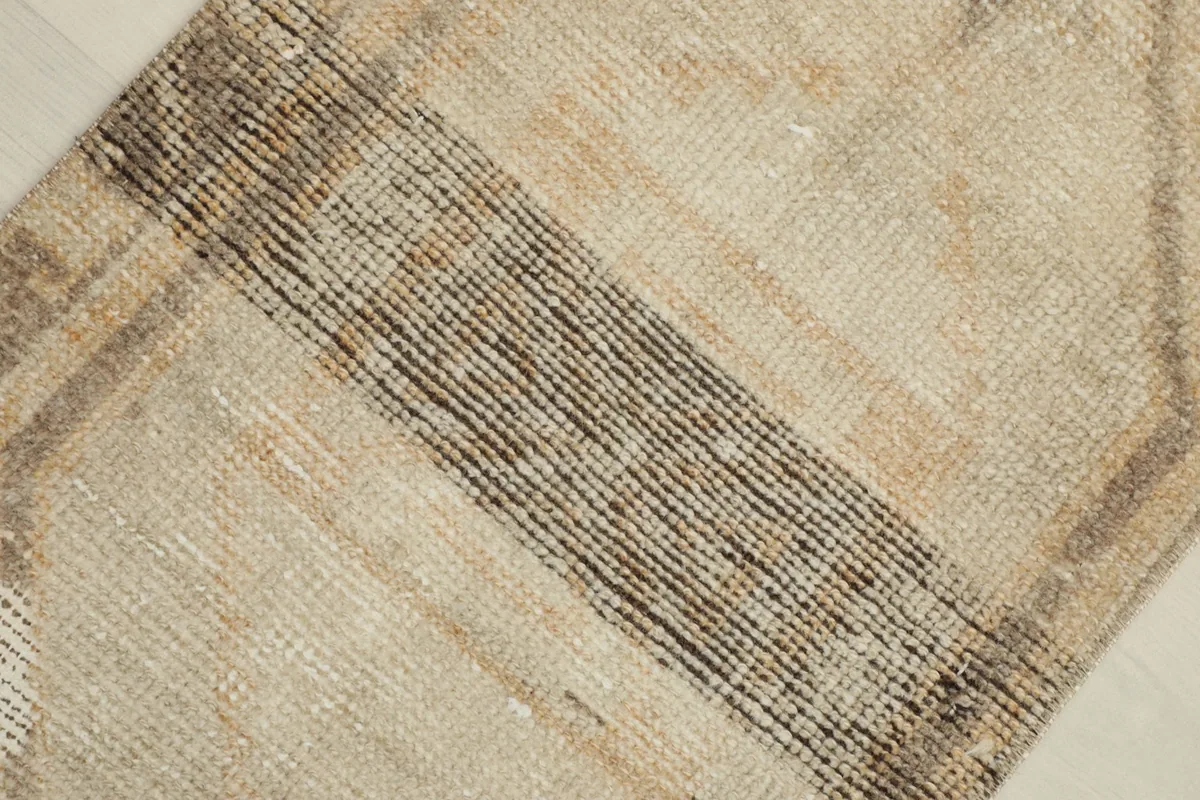 Overhead close-up of the central brown and charcoal striped section of the rug.