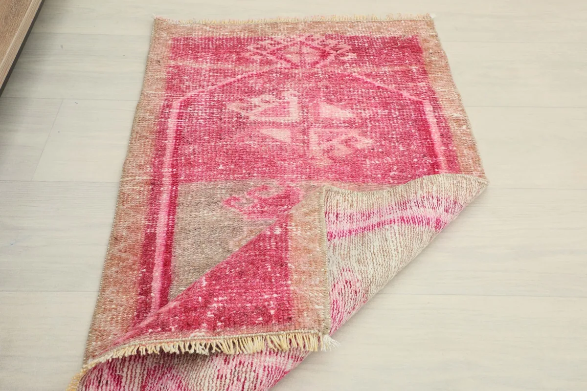 Overhead view of the rug with a corner folded back