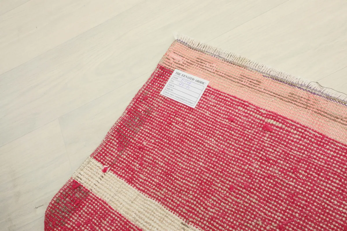Close-up of the back of the rug, revealing the tight hand-knotting and cotton foundation.