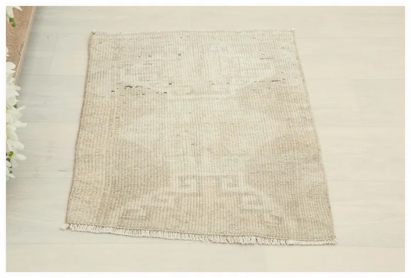 Full top view of the beige and tan geometric vintage Anatolian doormat rug