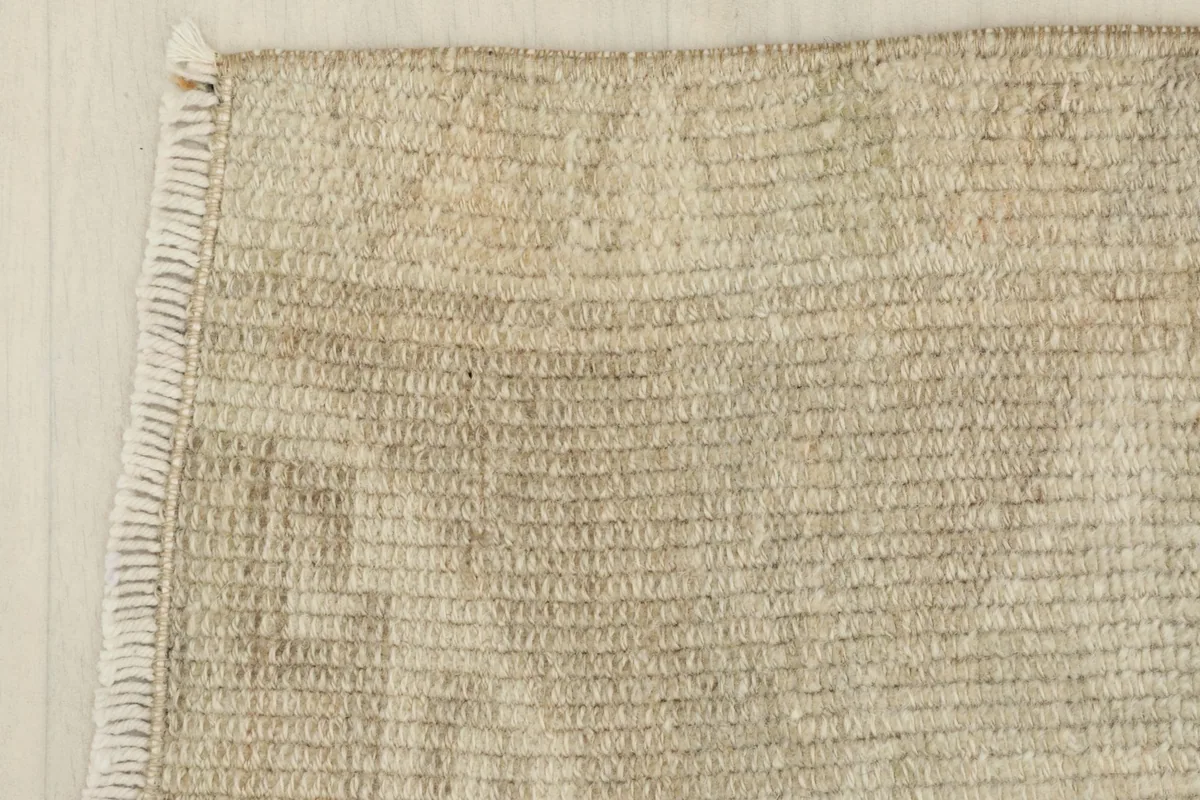 Close-up of a corner, showing the finished edge and subtle fringe