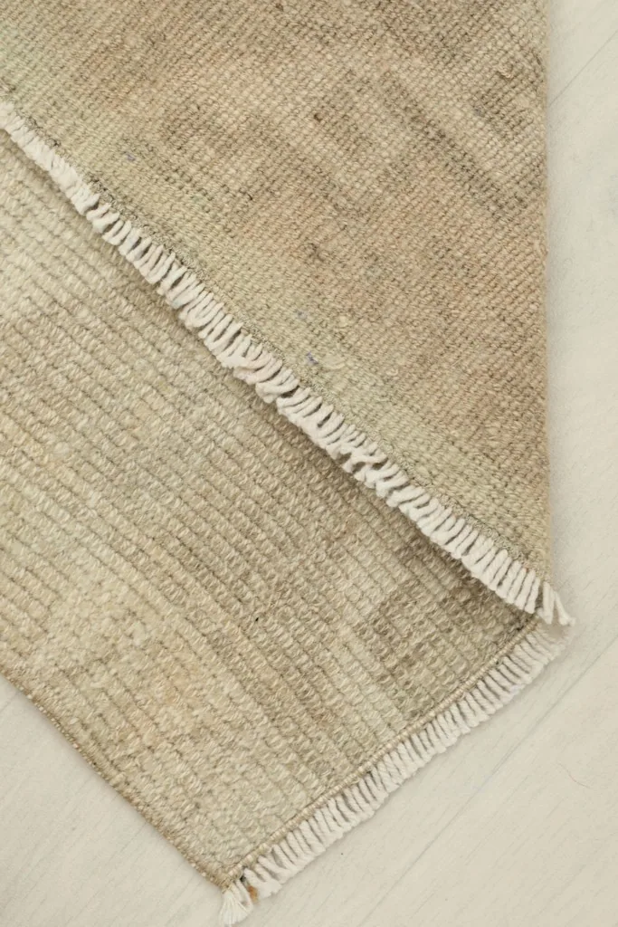 View of the rug folded, showing the flexibility and thickness of the material