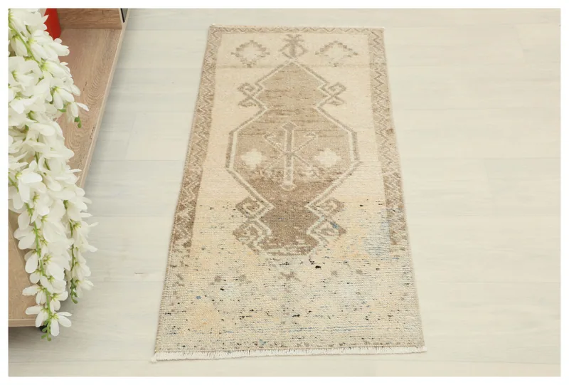 Full top view of the beige and brown geometric vintage Anatolian area rug