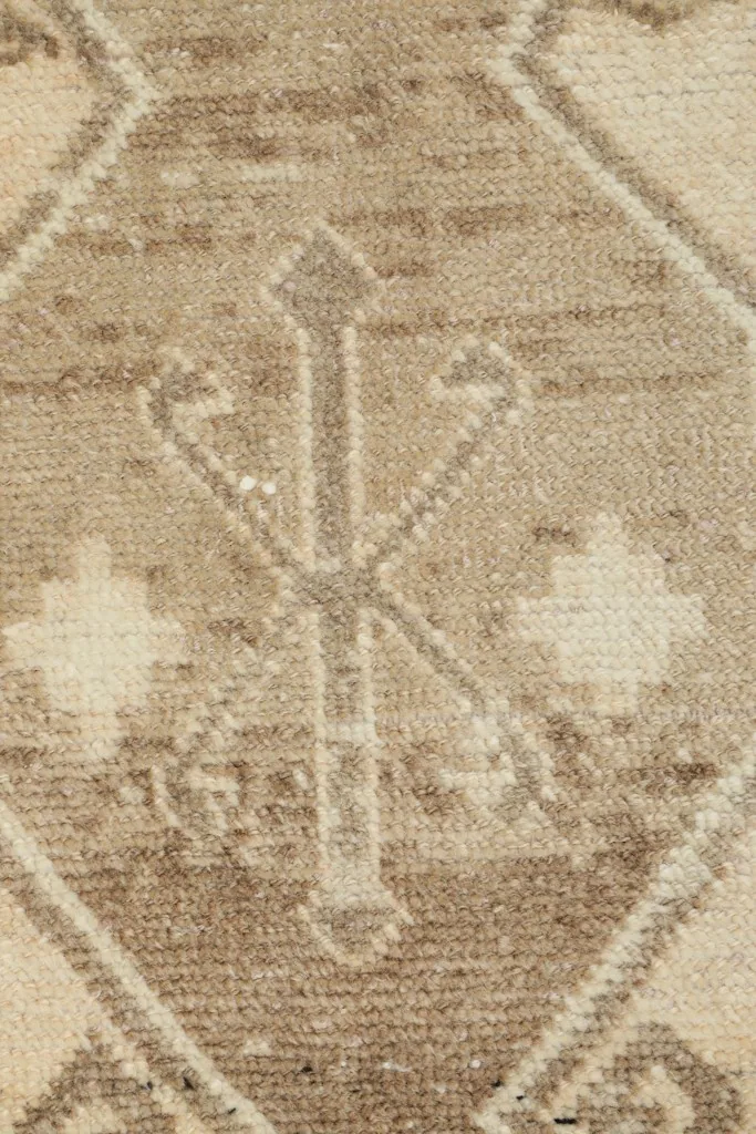 Detailed view of the specific tribal symbol within the central motif of the rug