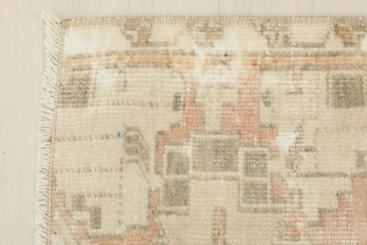 Close-up of the doormat's corner, showing the edge finish and subtle color variations