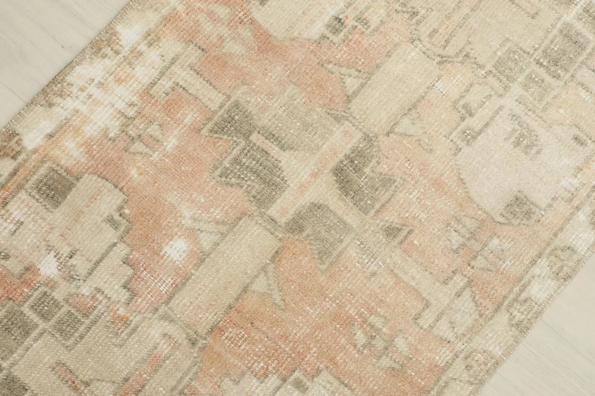 Overhead angled view highlighting the distressed geometric motifs and color variations