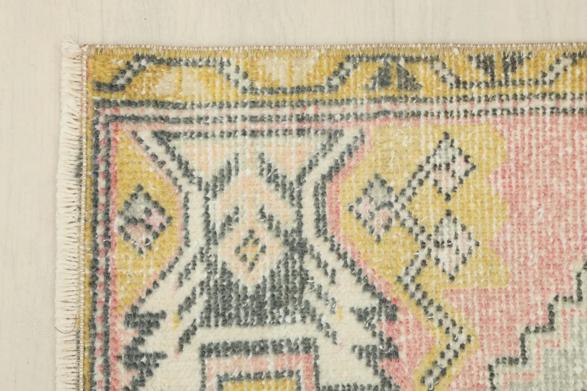 Close-up of the upper left corner, showing the distinct tribal geometric motifs