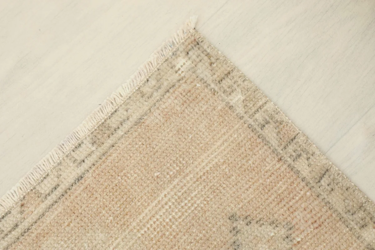 Opposite corner detail, showcasing the hand-knotted edge and the subtle color variations.