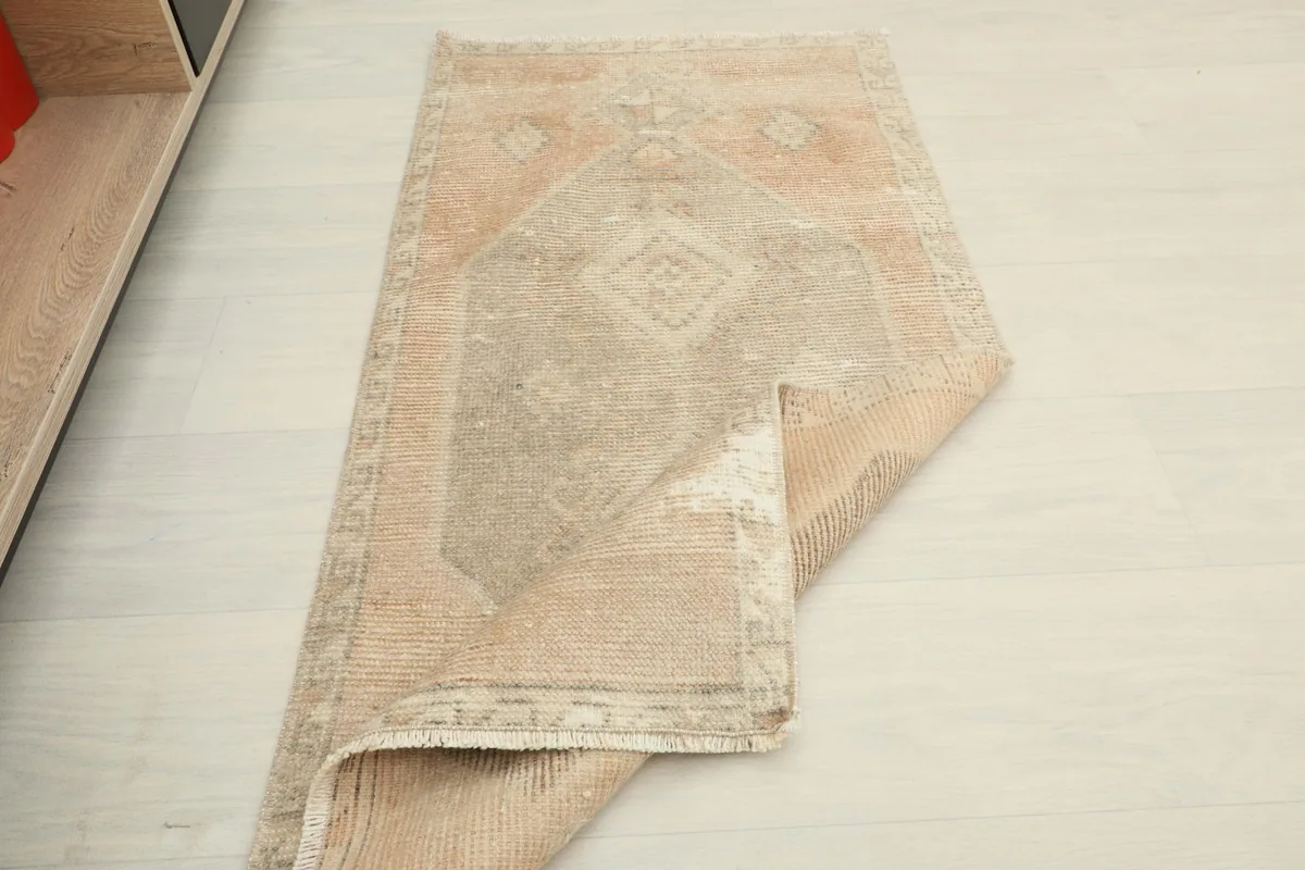 The rug partially folded, demonstrating its flexibility and the consistent pile across the surface.