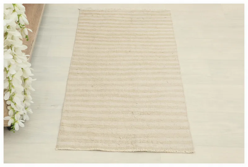 Full top view of the 1'8" x 3'1" vintage beige and tan striped doormat on a white background.