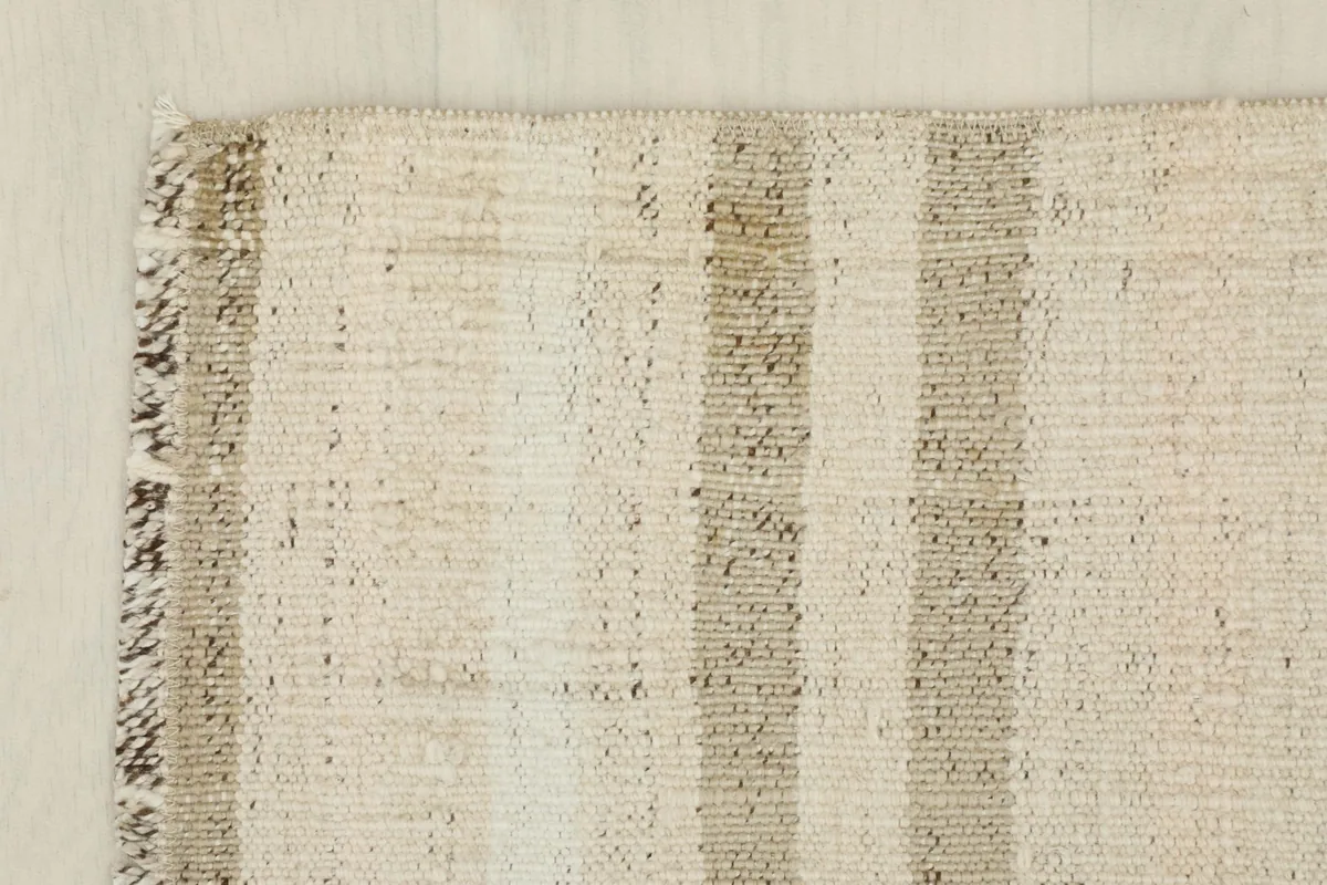 Edge detail of the rug, showing the consistent weave and subtle color shifts