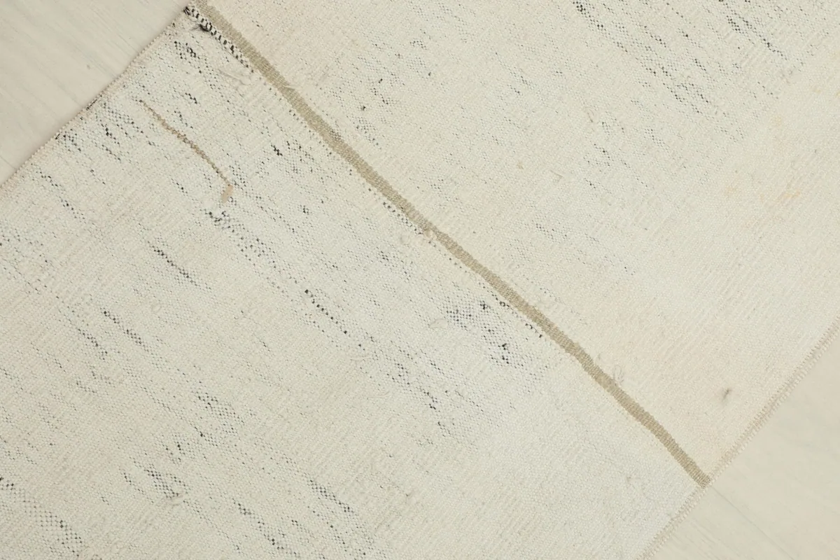 Partial overhead view of the rug, showing the division line and overall texture.
