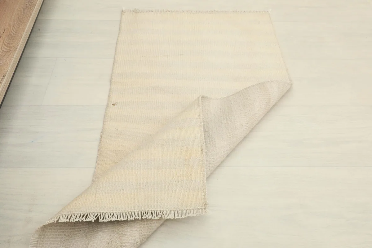 Partial view of the rug, showing its size and soft drape on the floor