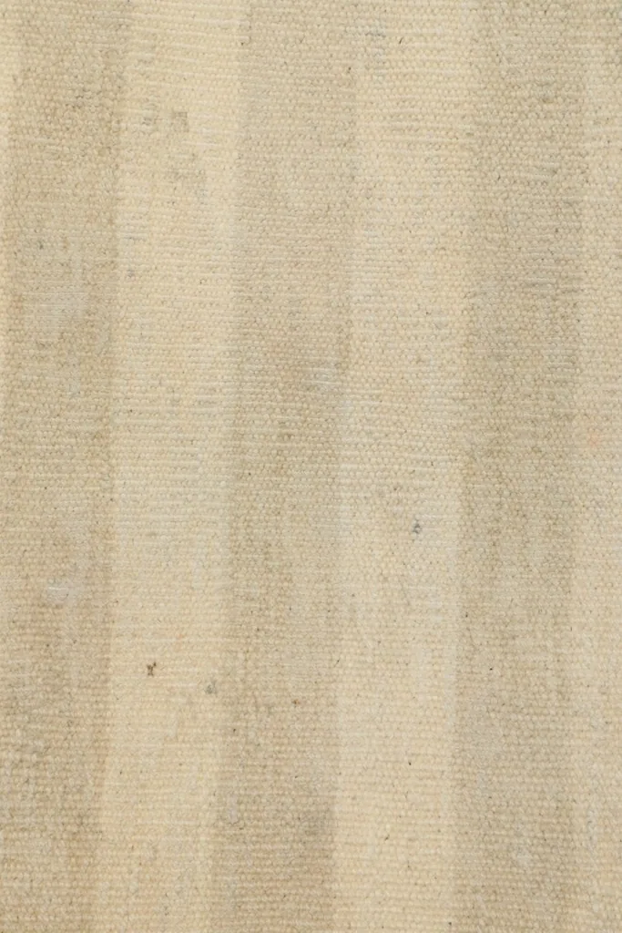 Detailed view of the low wool pile, revealing the texture and subtle color shifts within the stripes.