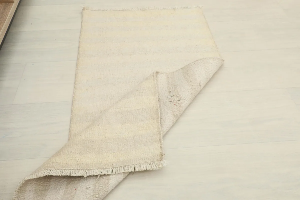 Another view of the rug folded, demonstrating its pliable nature and ease of handling.