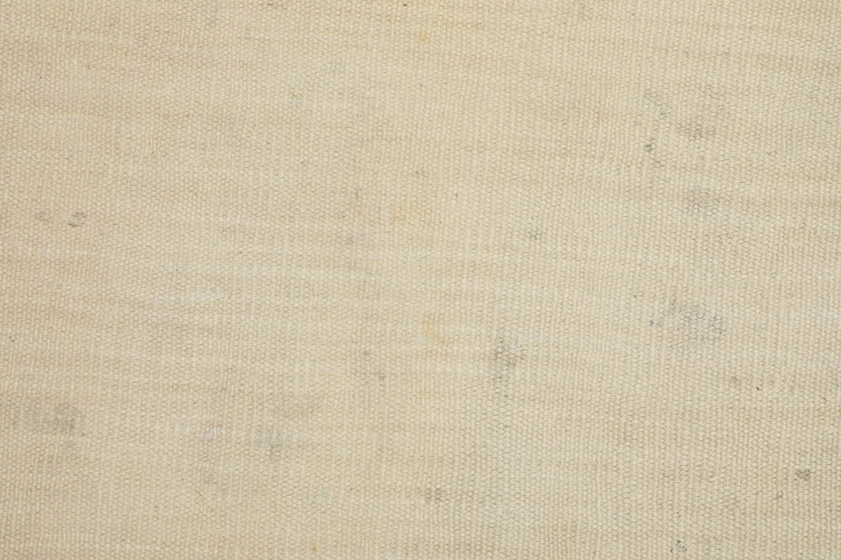 Detailed view of the hand-knotted wool pile, showing its tight weave and low height.