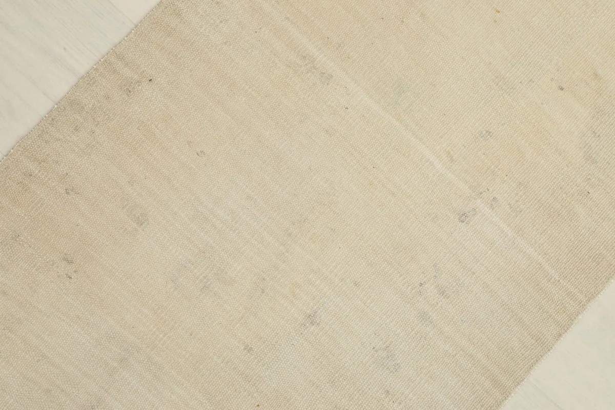 Overhead view highlighting the slight color variations and gentle patina across the rug's surface.