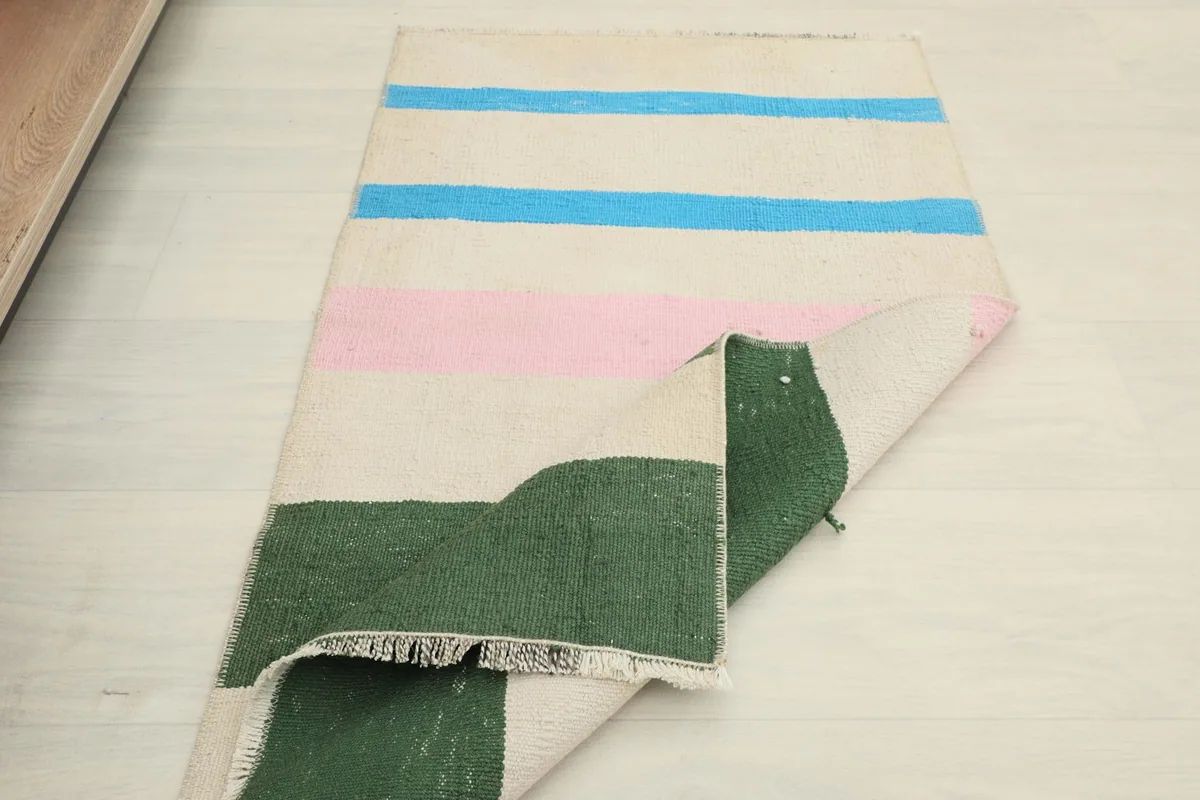 Another folded view of the rug, emphasizing its compact size and portability.