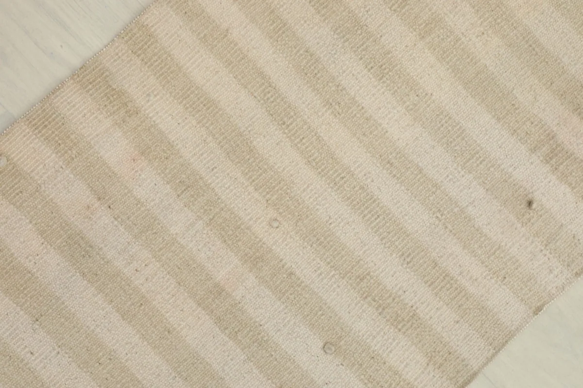 Overhead view of the beige and cream striped pattern, showing natural variations.