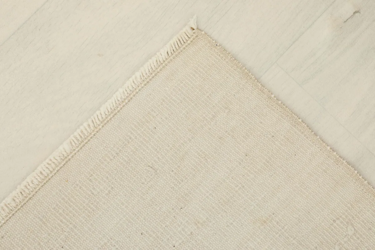 Another corner view, displaying the hand-finished edges and cotton foundation