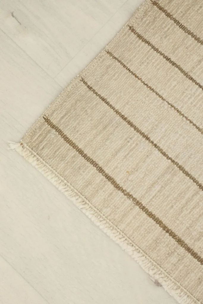 Overhead angled view of the doormat, emphasizing its rectangular shape and natural color variations.