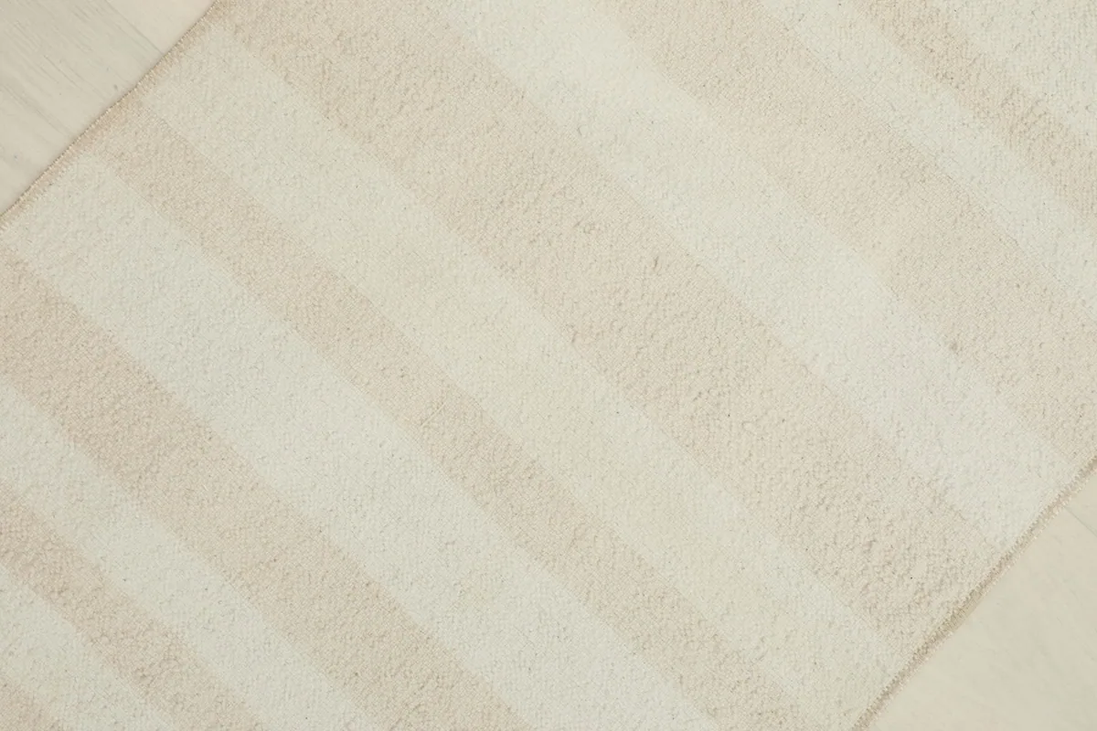 Diagonal view highlighting the subtle striped pattern and texture of the vintage Anatolian rug.