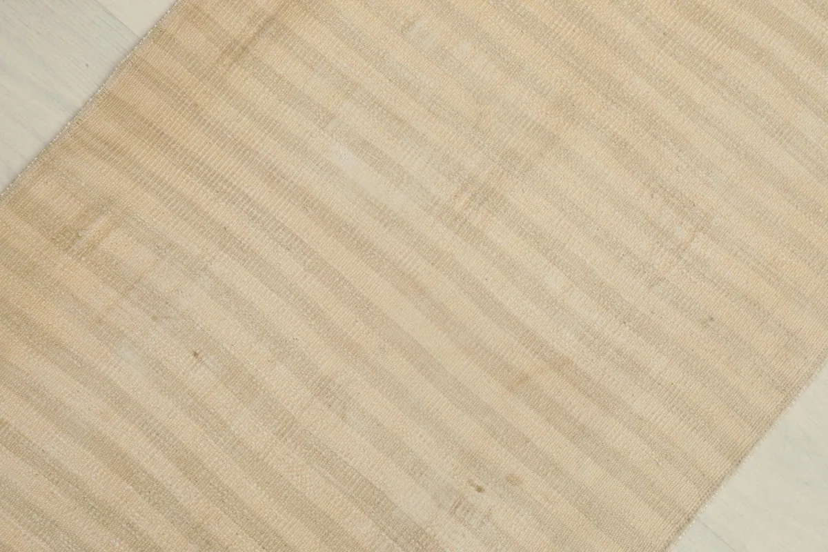 Overhead view capturing the overall subtle striped pattern and rectangular shape of the rug.
