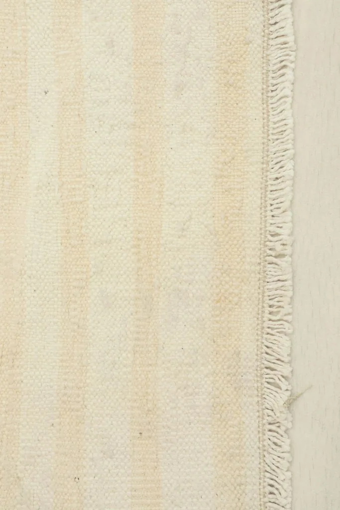 Close-up of the woven texture and fringe along one edge of the rug