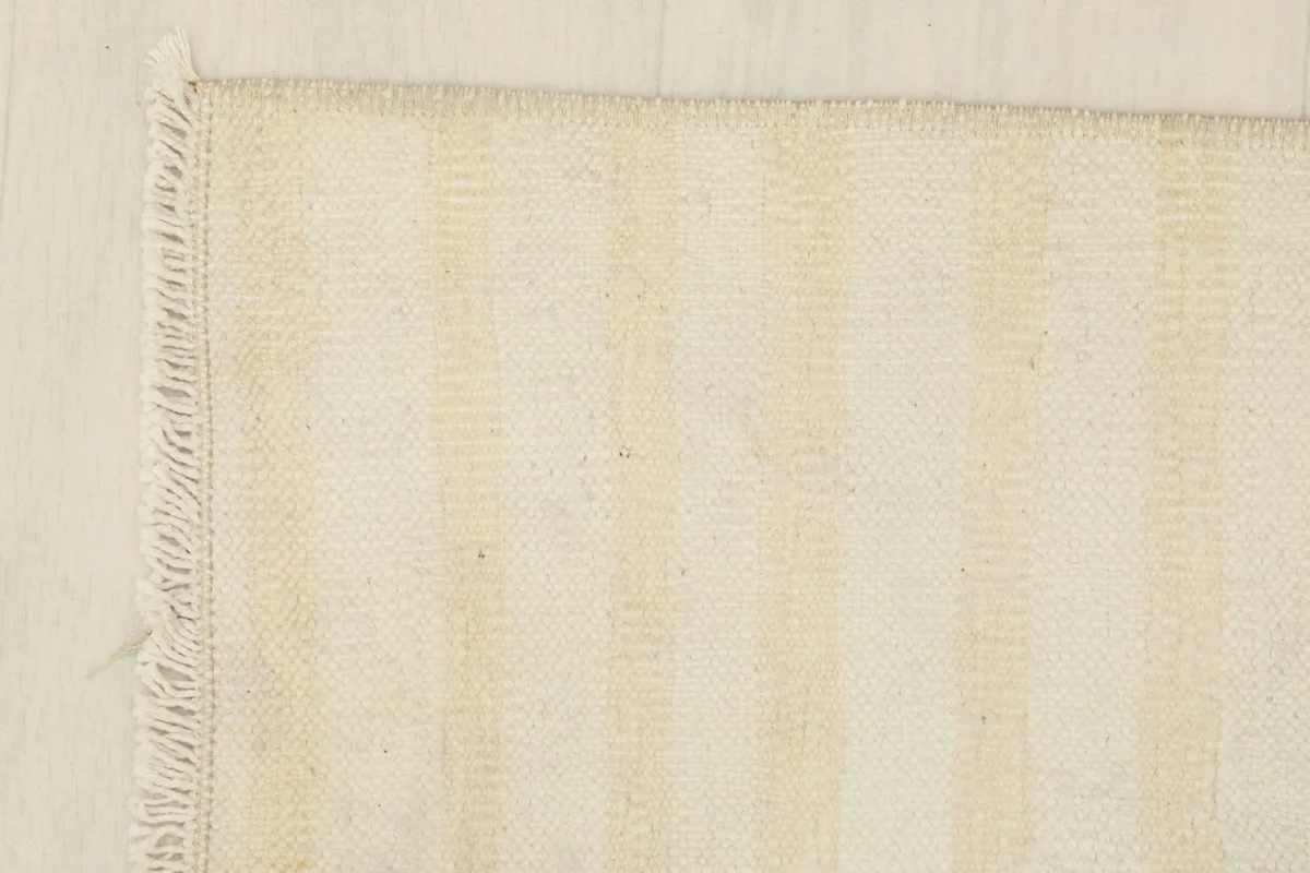 Corner detail showing the hand-knotted weave and short fringe